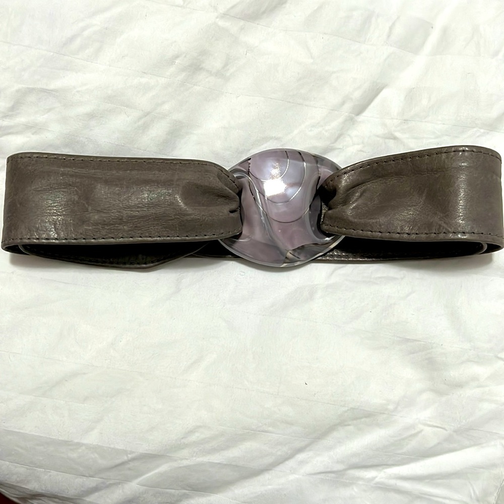 Adjustable gray ceramic and leather belt.